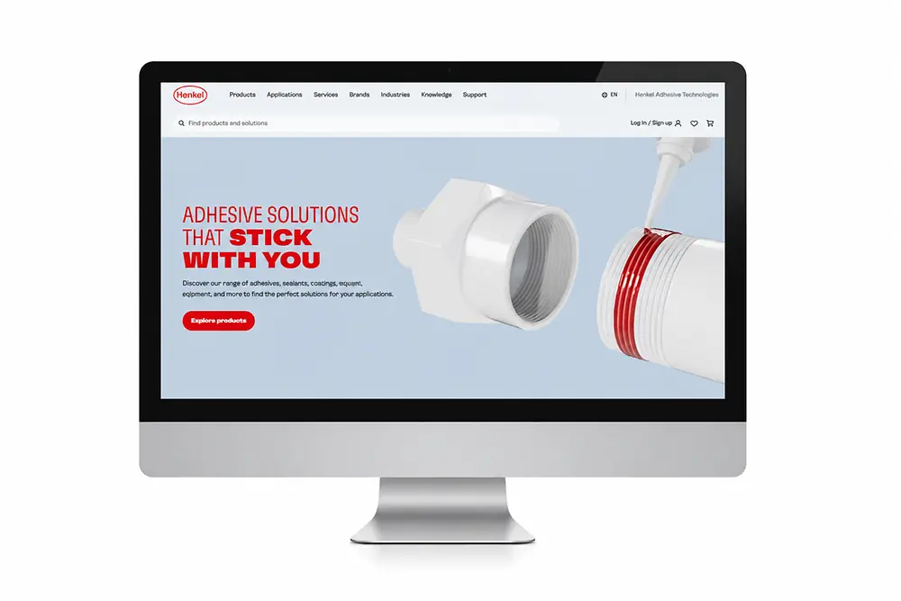 Monitorskjerm med Henkel Adhesive Technologies-nettstedet.